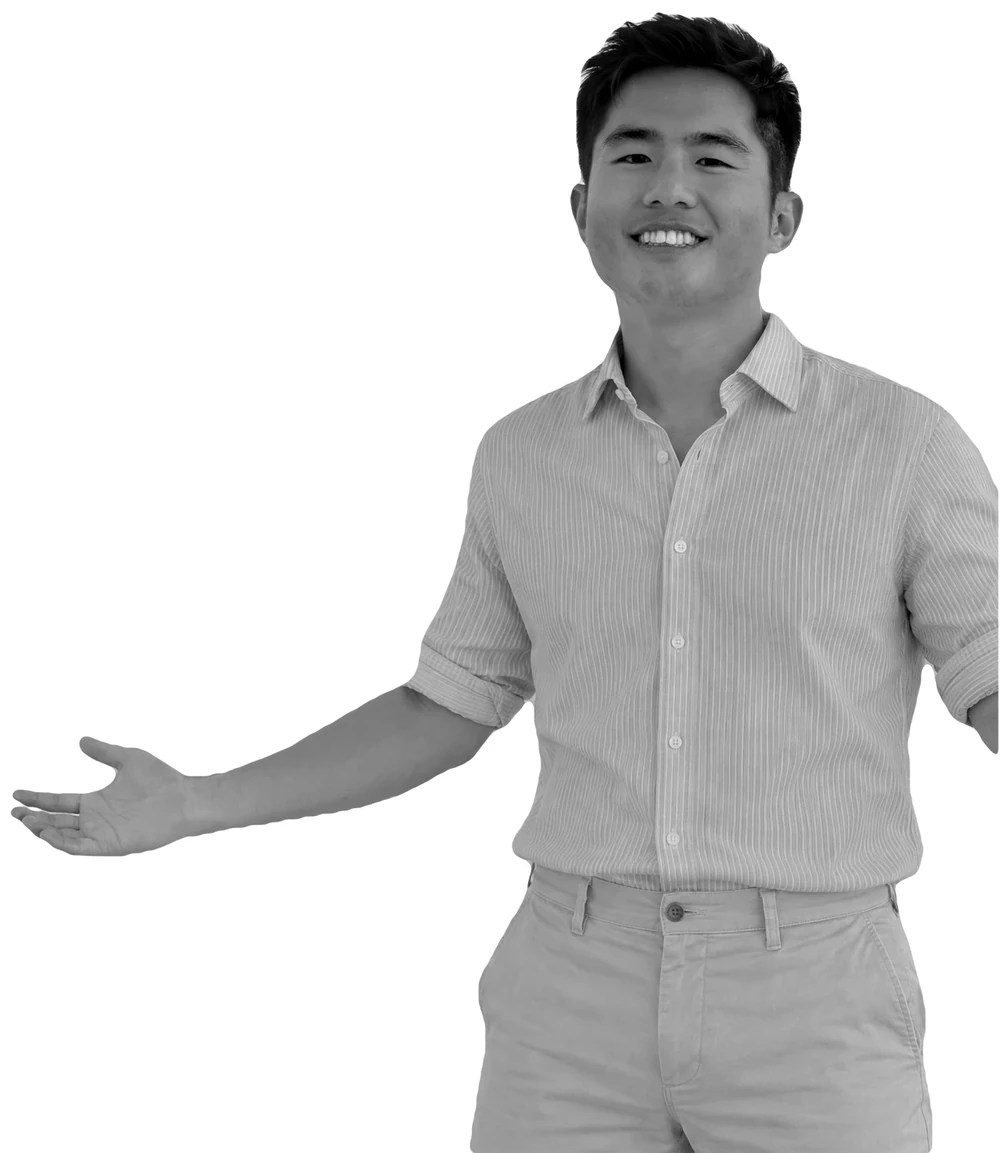 Lance smiling, one hand open toward the introduction